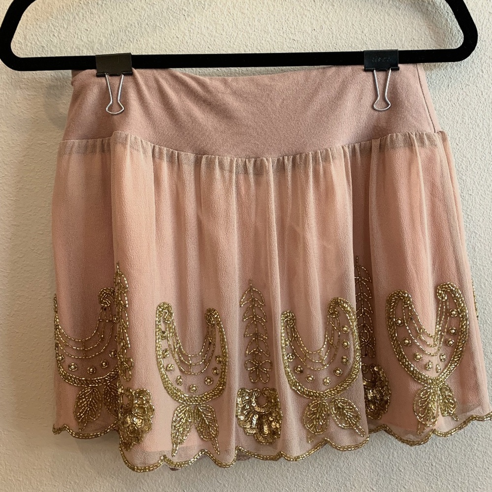 Blush mesh mini skirt with gold beading